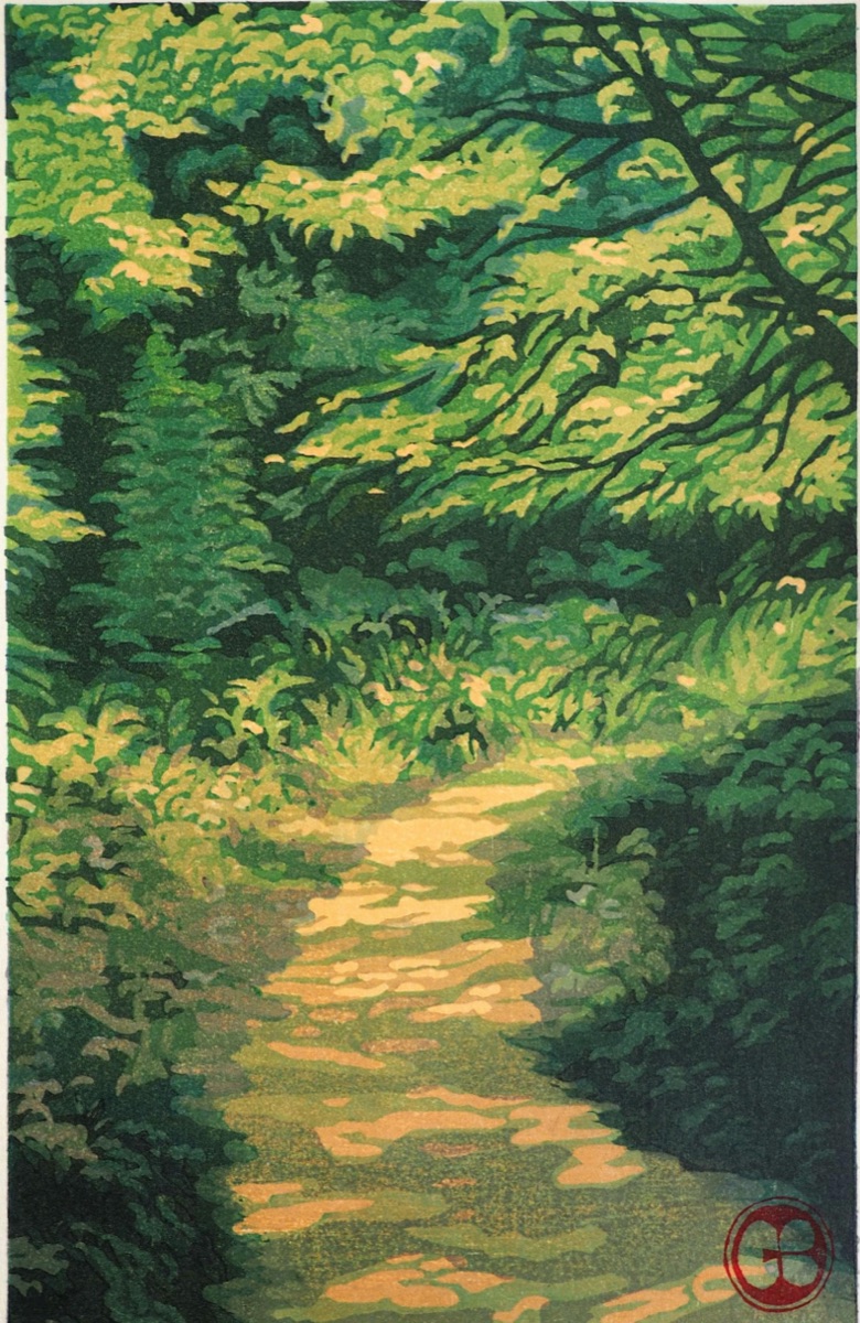 A sunlit path curving away into dense green woods, the canopy closing overhead.