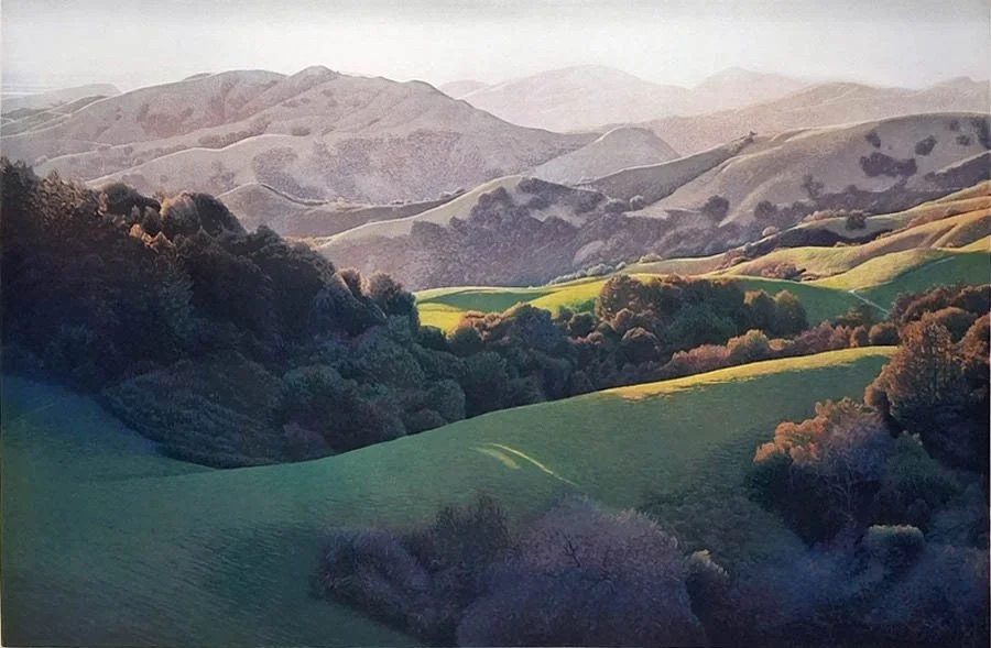 Green spring hills folding away above San Juan Bautista, oaks in the hollows and the coastal ridges stacked pale beyond.